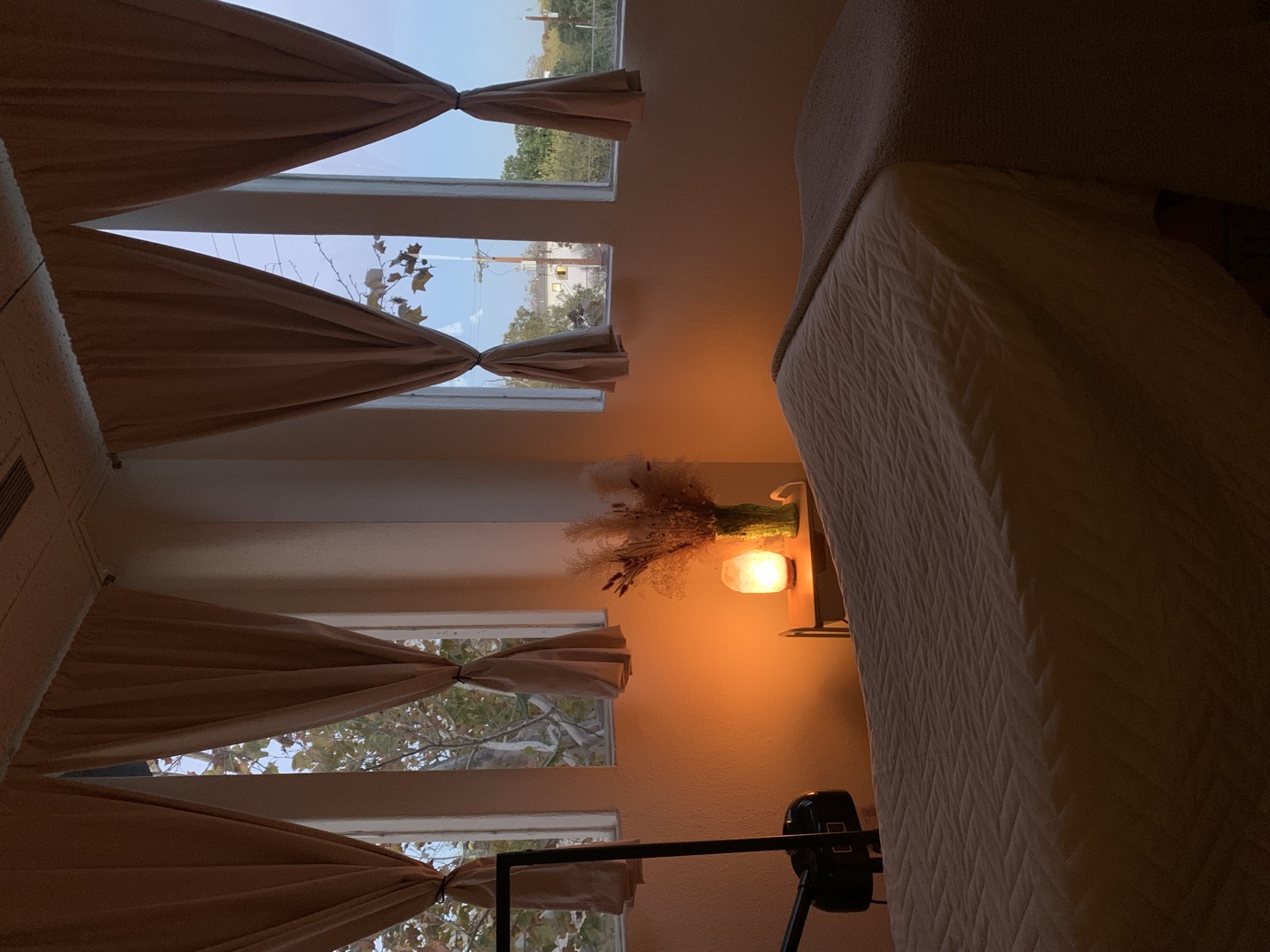 The treatment room at dusk, lit by a warm salt lamp